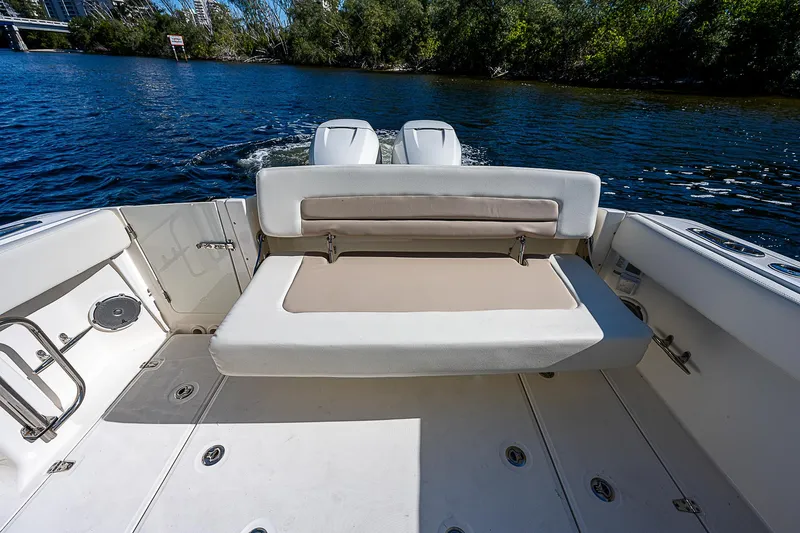  Yacht Photos Pics 2018 Boston Whaler 320 Vantage boat with rear seating and twin engines on a calm lake.