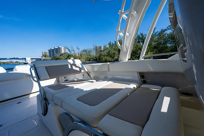  Yacht Photos Pics 2018 Boston Whaler 320 Vantage boat interior with cushioned seating.