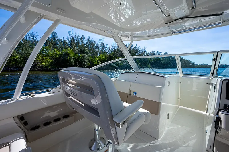  Yacht Photos Pics Interior of a 2018 Boston Whaler 320 Vantage boat with scenic water view.