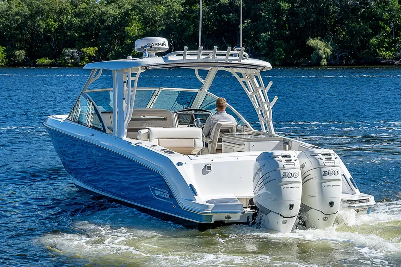  Yacht Photos Pics 2018 Boston Whaler 320 Vantage boat cruising on a lake with twin engines.