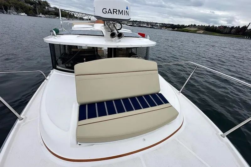 C Shell Yacht Photos Pics 2022 Ranger Tugs R-27 boat with Garmin equipment on a calm waterway.
