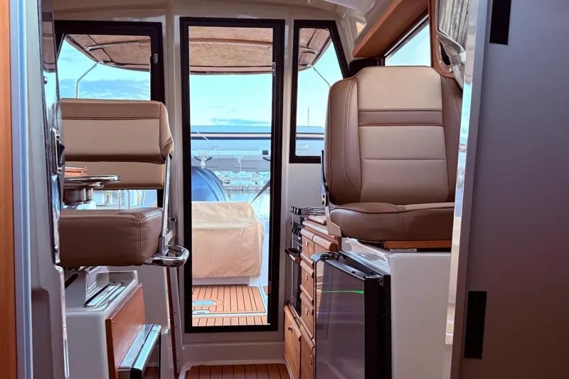 C Shell Yacht Photos Pics Interior of 2022 Ranger Tugs R-27 boat with leather seating and modern design.