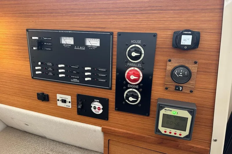 C Shell Yacht Photos Pics Control panel of a 2022 Ranger Tugs R-27 boat with various switches and gauges.
