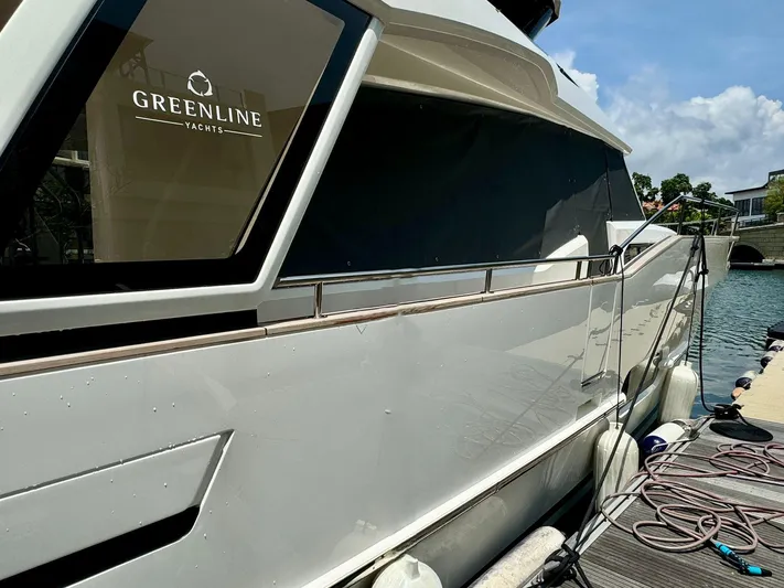  Yacht Photos Pics 2024 Greenline 48 Fly yacht docked, showcasing sleek design and modern features.
