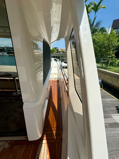  Yacht Photos Pics 2024 Greenline 48 Fly yacht side deck with sleek design and wooden flooring.