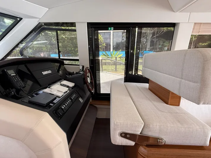  Yacht Photos Pics 2024 Greenline 48 Fly interior helm with Simrad electronics and plush seating.