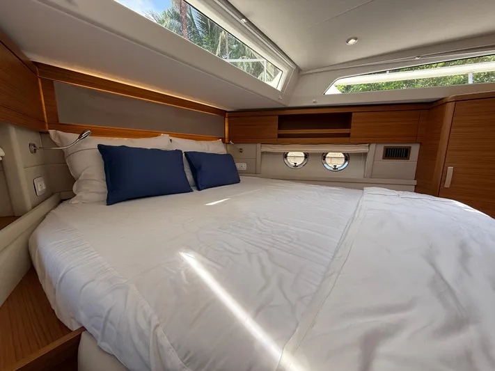  Yacht Photos Pics Luxurious cabin interior of 2024 Greenline 48 Fly yacht with cozy bedding.