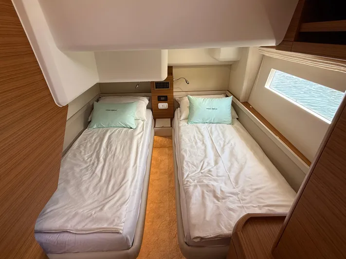 Yacht Photos Pics 2024 Greenline 48 Fly cabin with twin beds and modern wood finish.