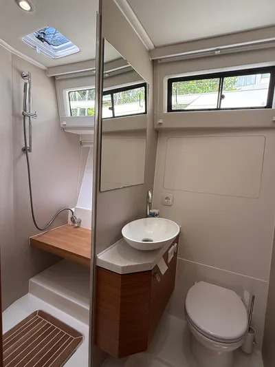  Yacht Photos Pics 2024 Greenline 48 Fly yacht bathroom with modern fixtures and natural lighting.