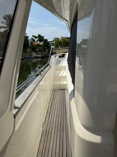  Yacht Photos Pics Side deck view of 2024 Greenline 48 Fly yacht, featuring sleek design and wooden flooring.