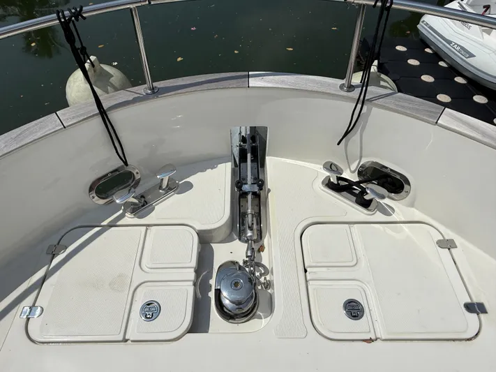  Yacht Photos Pics Bow area of 2024 Greenline 48 Fly yacht with anchor and storage compartments.