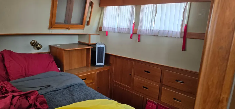 Grand Finale Yacht Photos Pics Interior cabin of a 1991 Grand Banks 36 Classic yacht with wood furnishings.