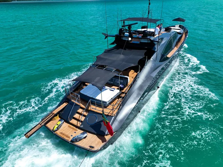  Yacht Photos Pics Luxurious 2003 Palmer Johnson 120 yacht cruising on turquoise waters.