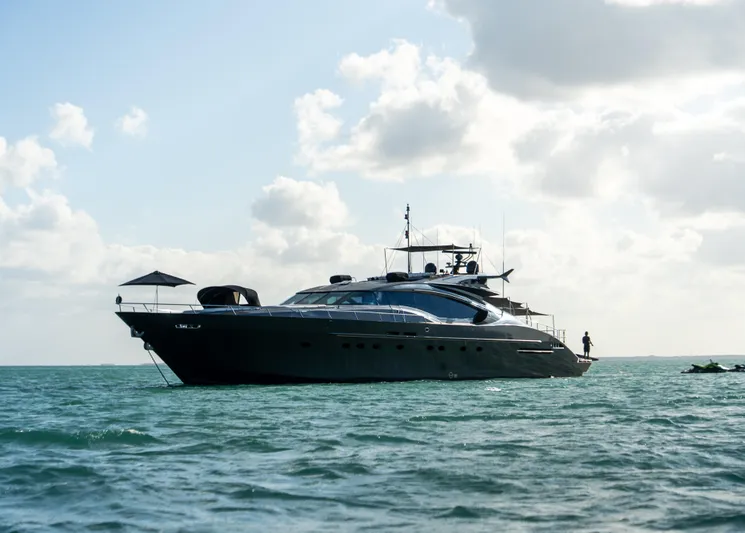  Yacht Photos Pics Luxury Palmer Johnson 120 yacht from 2003 on calm sea under cloudy sky.