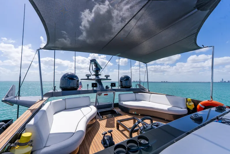  Yacht Photos Pics Luxurious Palmer Johnson 120 yacht deck with seating, ocean view, and sunshade, 2003 model.