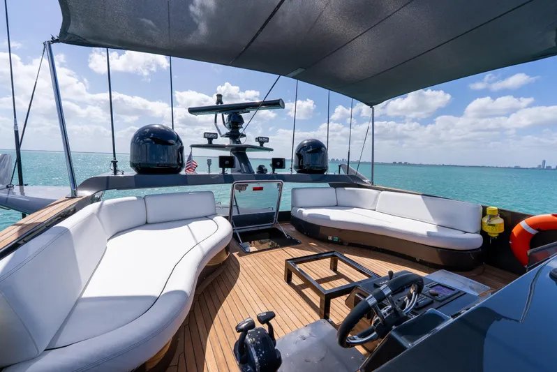  Yacht Photos Pics Luxurious Palmer Johnson 120 yacht deck with seating, ocean view, and clear skies, 2003 model.