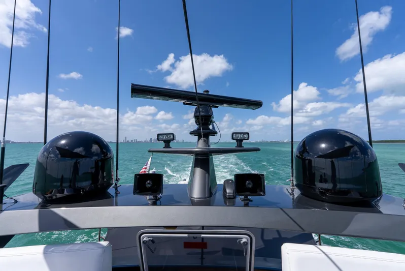  Yacht Photos Pics Palmer Johnson 120 yacht bridge view, 2003 model, navigating turquoise waters under blue sky.