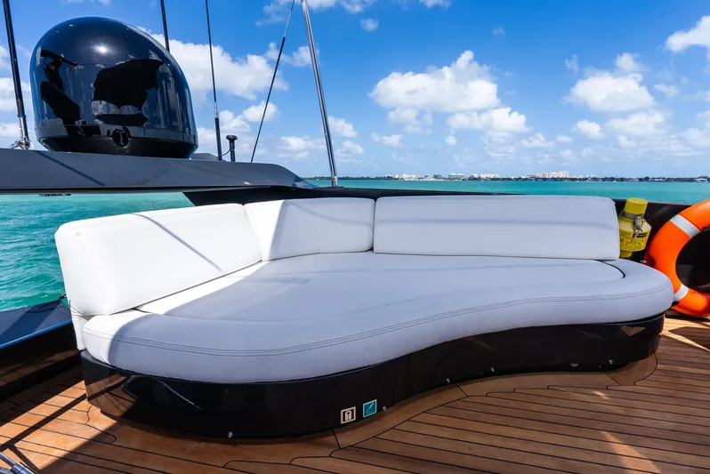  Yacht Photos Pics Luxurious deck seating on 2003 Palmer Johnson 120 yacht, with ocean view and clear skies.