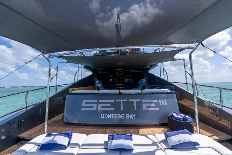  Yacht Photos Pics Luxurious Palmer Johnson 120 yacht deck with sun loungers, shade canopy, and ocean view.