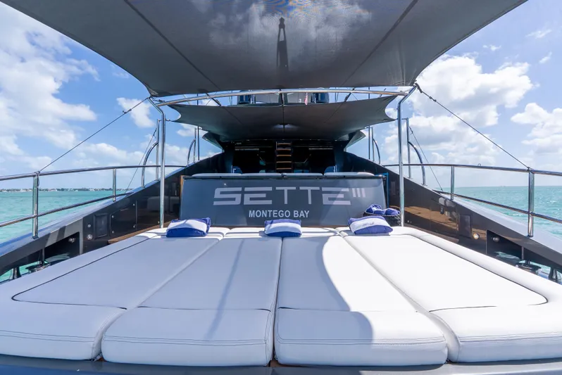  Yacht Photos Pics Luxurious Palmer Johnson 120 yacht deck with sunbeds, Montego Bay, 2003 model.