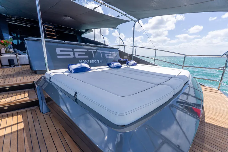  Yacht Photos Pics Luxurious Palmer Johnson 120 yacht deck with sunbed, ocean view, and clear skies.