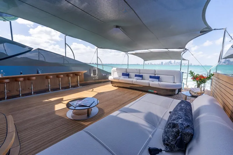  Yacht Photos Pics Luxurious Palmer Johnson 120 yacht deck with elegant seating, bar, and ocean view, 2003 model.