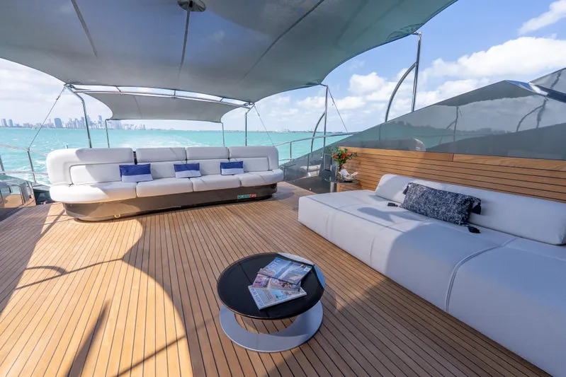  Yacht Photos Pics Luxurious Palmer Johnson 120 yacht deck with elegant seating, ocean view, and modern design, 2003 model.