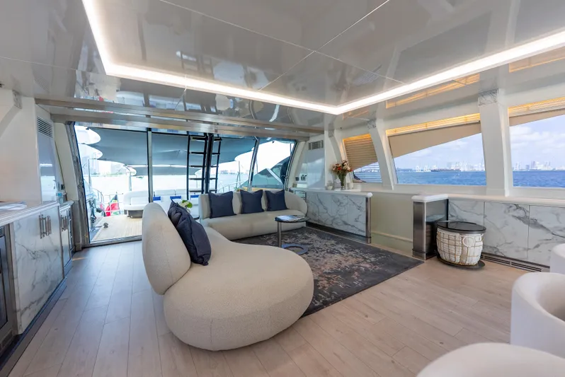  Yacht Photos Pics Luxurious interior of 2003 Palmer Johnson 120 yacht with modern furnishings and panoramic windows.