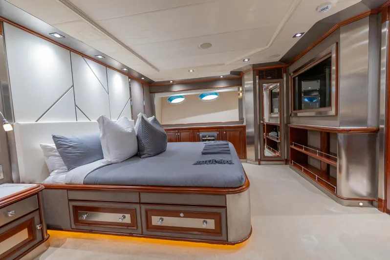  Yacht Photos Pics Luxurious bedroom interior of 2003 Palmer Johnson 120 yacht with modern design and elegant furnishings.
