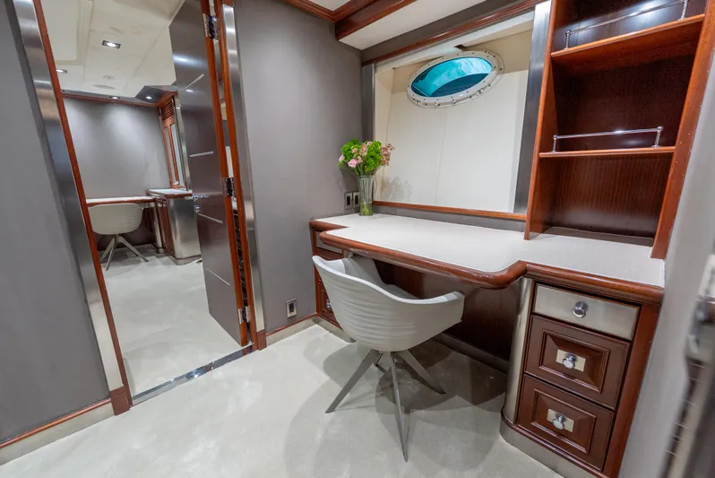  Yacht Photos Pics Luxurious interior of 2003 Palmer Johnson 120 yacht with elegant desk and chair setup.
