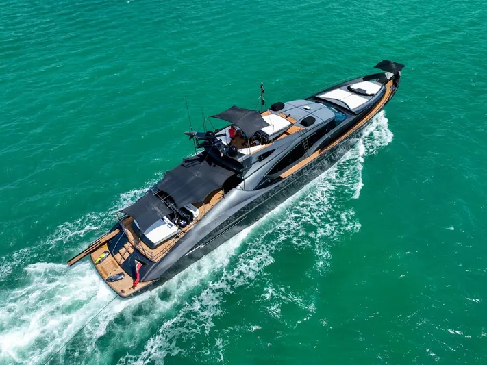  Yacht Photos Pics Luxurious 2003 Palmer Johnson 120 yacht cruising on turquoise waters.