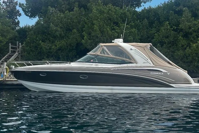  Yacht Photos Pics 2016 Formula 350 Sunsport boat docked by lush greenery.