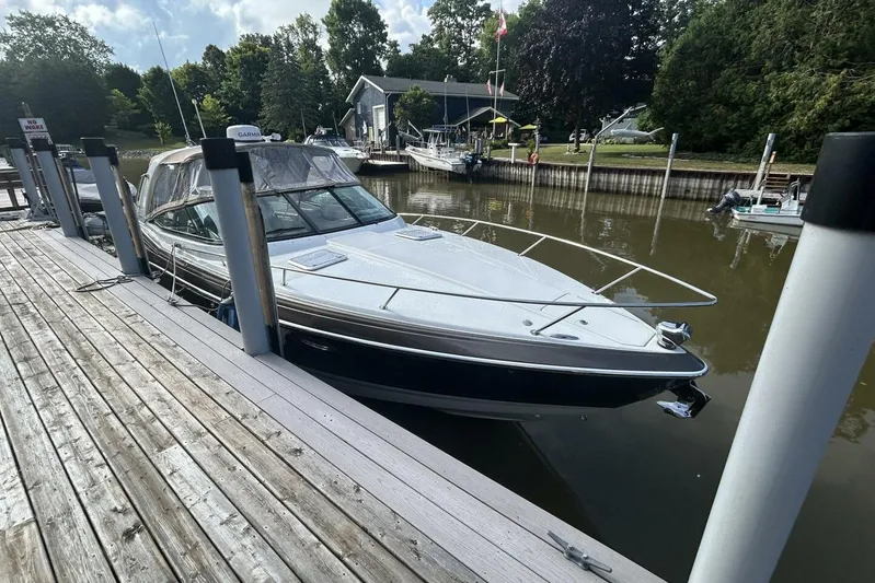  Yacht Photos Pics 2016 Formula 350 Sunsport docked at a serene marina with lush greenery.