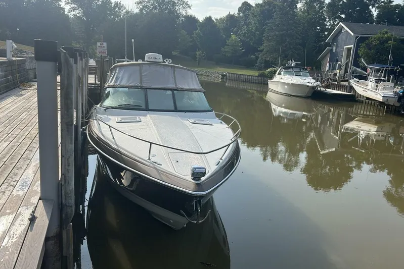  Yacht Photos Pics 2016 Formula 350 Sunsport boat docked in a serene marina setting.