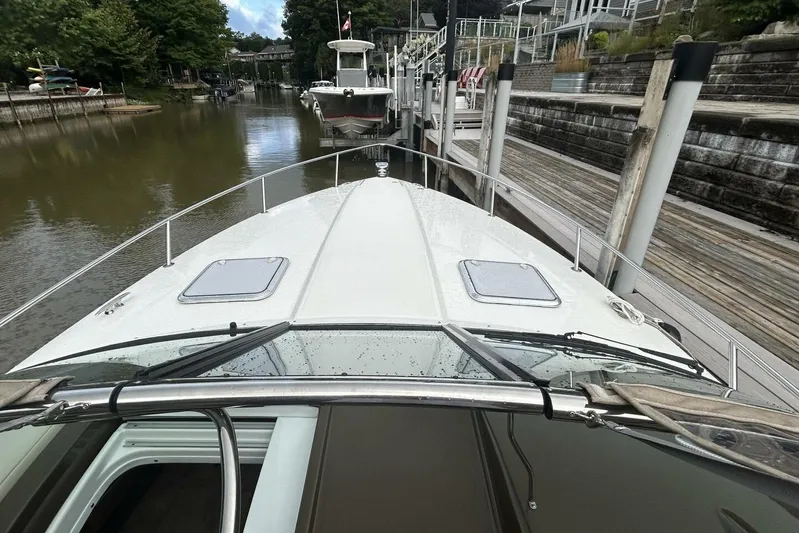  Yacht Photos Pics 2016 Formula 350 Sunsport boat docked in a serene canal setting.