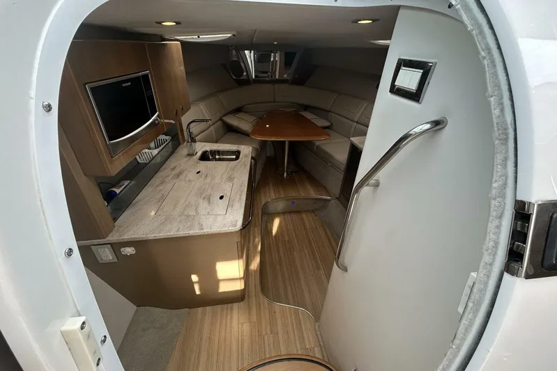  Yacht Photos Pics Interior of 2016 Formula 350 Sunsport boat with kitchenette and seating area.