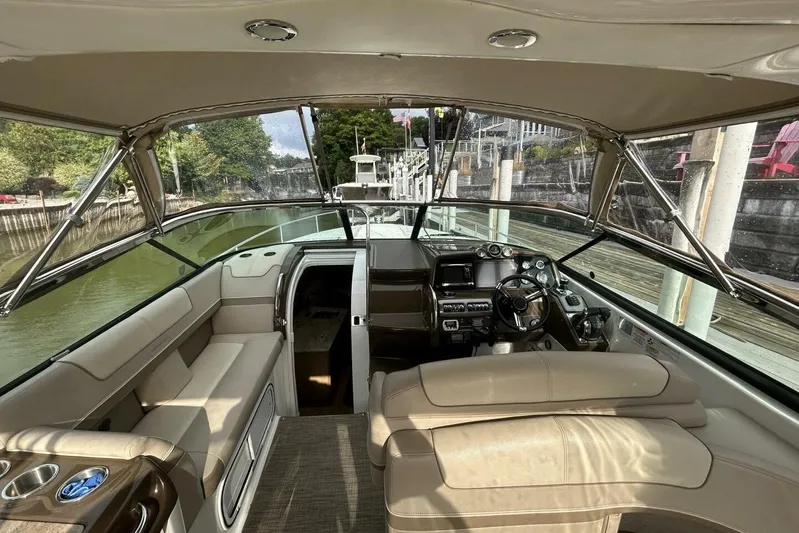  Yacht Photos Pics Interior view of 2016 Formula 350 Sunsport boat, featuring helm and seating area.
