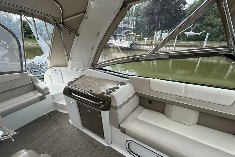  Yacht Photos Pics Interior of a 2016 Formula 350 Sunsport boat with seating and kitchenette.