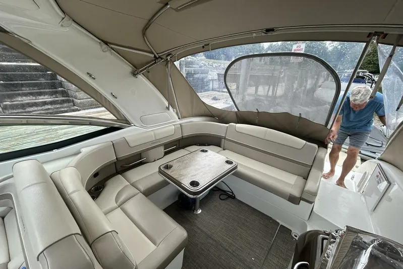  Yacht Photos Pics 2016 Formula 350 Sunsport boat interior with seating and table, person entering.