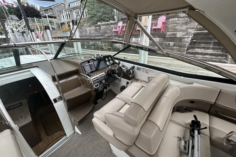  Yacht Photos Pics 2016 Formula 350 Sunsport boat interior with beige seating and modern dashboard.