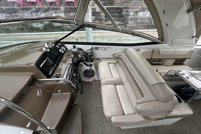  Yacht Photos Pics Interior of a 2016 Formula 350 Sunsport boat with beige seating and modern dashboard.