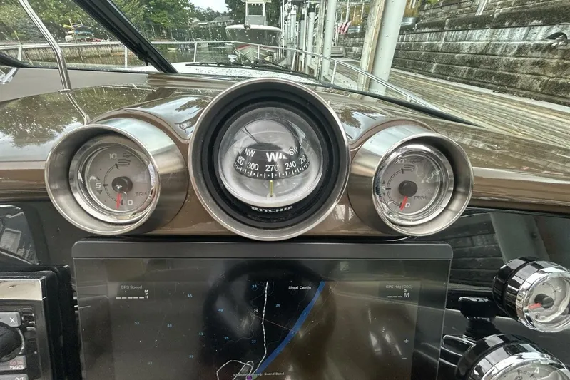  Yacht Photos Pics Dashboard of a 2016 Formula 350 Sunsport boat with compass and gauges.
