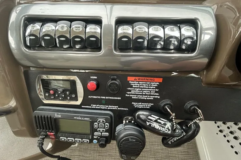  Yacht Photos Pics Control panel of a 2016 Formula 350 Sunsport boat with switches and radio.