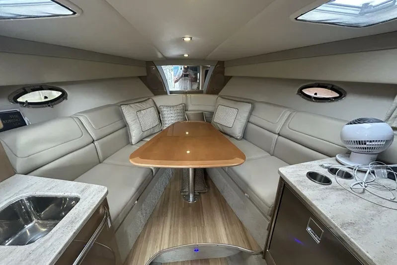  Yacht Photos Pics Interior of 2016 Formula 350 Sunsport yacht with elegant seating and wooden table.