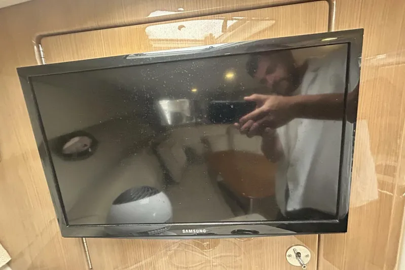  Yacht Photos Pics Samsung TV inside 2016 Formula 350 Sunsport boat, reflecting interior cabin details.
