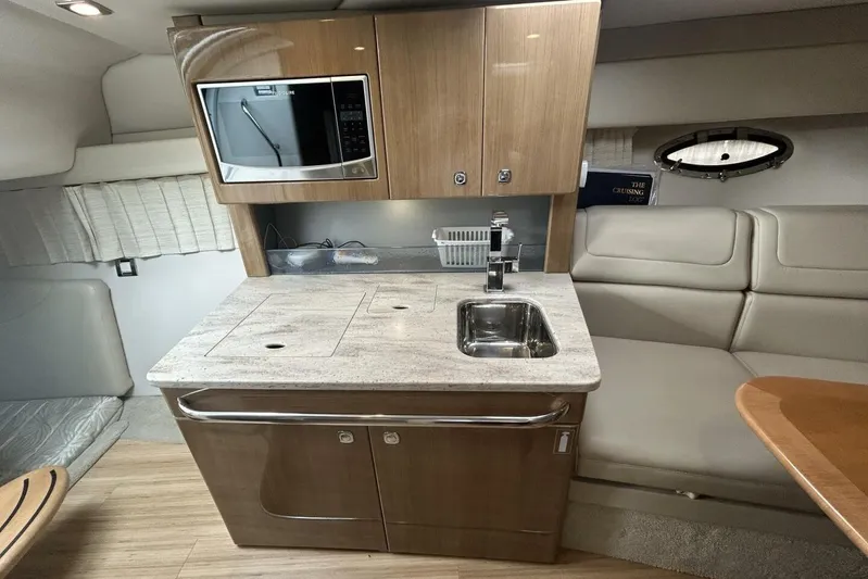  Yacht Photos Pics 2016 Formula 350 Sunsport yacht interior with kitchenette, microwave, and seating area.