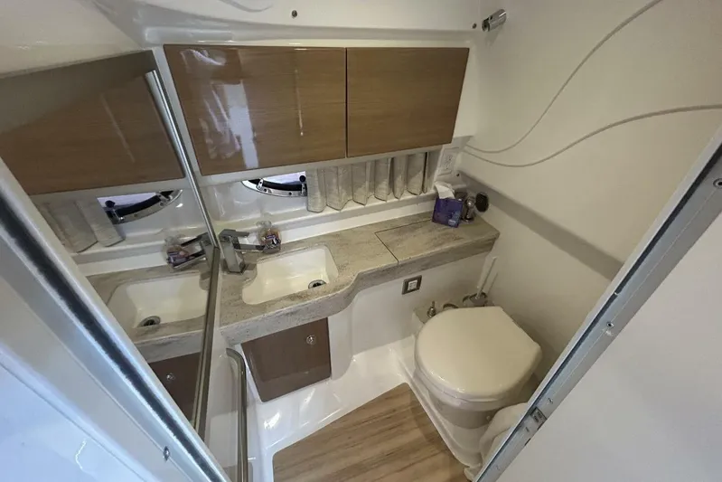  Yacht Photos Pics 2016 Formula 350 Sunsport bathroom with sink, mirror, and toilet.