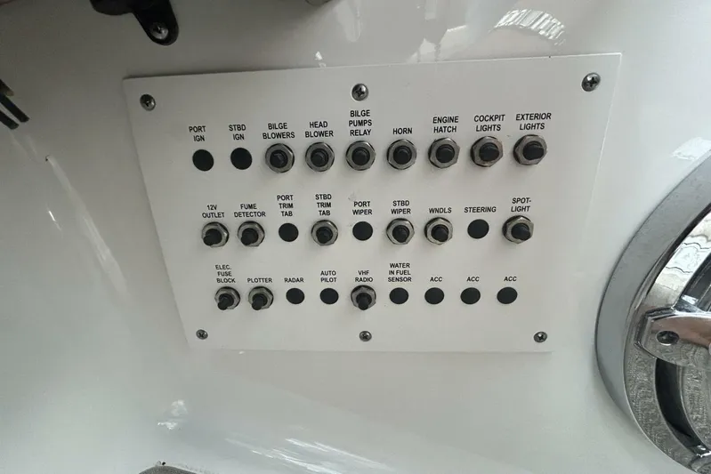  Yacht Photos Pics Control panel of a 2016 Formula 350 Sunsport boat with labeled switches and buttons.