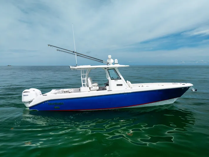  Yacht Photos Pics 2019 Everglades 335 Center Console boat on calm ocean waters.