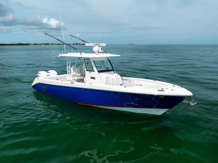  Yacht Photos Pics 2019 Everglades 335 Center Console boat on calm ocean waters.